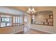Open living area featuring tile floors, decorative archways, and custom light fixtures at 3 Pine Hollow Dr, Henderson, NV 89052
