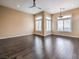 Spacious living room featuring hardwood floors, and bright windows at 3 Pine Hollow Dr, Henderson, NV 89052