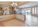 Open living area with tile floors, stone accent wall, and sliding glass doors to the backyard at 3 Pine Hollow Dr, Henderson, NV 89052