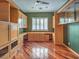 Large home office with hardwood floors, custom cabinetry and shelving at 3 Pine Hollow Dr, Henderson, NV 89052