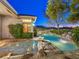 Picturesque backyard pool and patio area, ideal for outdoor entertaining with lush landscaping at 3 Pine Hollow Dr, Henderson, NV 89052