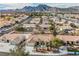 Aerial view of a house in a mountain residential neighborhood at 3105 Birdwood Dr, Las Vegas, NV 89134