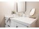 Modern bathroom vanity with white quartz countertop, updated fixtures, and stylish mirror at 3105 Birdwood Dr, Las Vegas, NV 89134