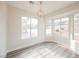 Bright breakfast nook with large windows and wood flooring at 3105 Birdwood Dr, Las Vegas, NV 89134