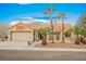 Single-story home with desert landscaping and a two-car garage at 3105 Birdwood Dr, Las Vegas, NV 89134