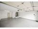 Attached garage with painted floor, extra storage, and water heater at 3105 Birdwood Dr, Las Vegas, NV 89134