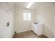 Bright laundry room with white cabinets, a utility sink, and ample shelving at 3105 Birdwood Dr, Las Vegas, NV 89134