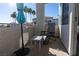 Private balcony with patio furniture and partial view at 3125 N Buffalo Dr # 2120, Las Vegas, NV 89128