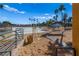 Community beach features a lifeguard stand and lounging area surrounded by palm trees and sandy beach at 3125 N Buffalo Dr # 2120, Las Vegas, NV 89128