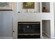 Built-in fireplace with a tiled surround at 3125 N Buffalo Dr # 2120, Las Vegas, NV 89128