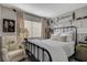 Bedroom with a metal bed frame and neutral color scheme at 330 Shadybrook Ln # D, Las Vegas, NV 89107