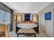 Elegant bedroom featuring a large four-poster bed and stylish decor at 330 Shadybrook Ln # D, Las Vegas, NV 89107