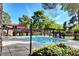 Community swimming pool with surrounding landscaping at 330 Shadybrook Ln # D, Las Vegas, NV 89107