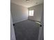 Bright bedroom with carpet flooring and a large window at 3414 Mount Charleston Dr, Pahrump, NV 89048