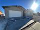 New construction home featuring a white garage door and neutral exterior at 3414 Mount Charleston Dr, Pahrump, NV 89048