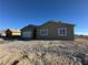 New construction home showcasing a neutral exterior and gravel landscaping at 3414 Mount Charleston Dr, Pahrump, NV 89048