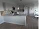 Modern kitchen with gray cabinets, granite countertops, and breakfast bar at 3414 Mount Charleston Dr, Pahrump, NV 89048