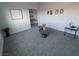 Modern living room with gray carpet, stylish decor, and natural light at 3414 Mount Charleston Dr, Pahrump, NV 89048