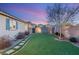 Landscaped backyard with stone pathway at 3484 Bradano Ln, Henderson, NV 89044