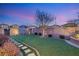 Landscaped backyard with stone pathway and wall at 3484 Bradano Ln, Henderson, NV 89044