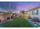 Backyard with water feature and lush landscaping at 3484 Bradano Ln, Henderson, NV 89044