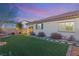 Landscaped backyard with grass and stepping stones at 3484 Bradano Ln, Henderson, NV 89044