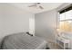 Cozy bedroom with a ceiling fan and window at 3484 Bradano Ln, Henderson, NV 89044