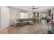 Living room with hardwood floors, sectional sofa, and kitchen access at 3484 Bradano Ln, Henderson, NV 89044