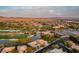 Aerial view of community with golf course and lake at 3514 Old Course St, Las Vegas, NV 89122