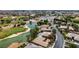 Aerial view of homes surrounding a lake and golf course at 3514 Old Course St, Las Vegas, NV 89122