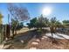 Landscaped backyard featuring desert landscaping and views of the golf course at 3514 Old Course St, Las Vegas, NV 89122