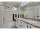 Bathroom with granite countertop double vanity and shower/tub combo at 3514 Old Course St, Las Vegas, NV 89122