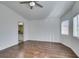 Large bedroom with hardwood floors, ceiling fan and access to bathroom at 3514 Old Course St, Las Vegas, NV 89122