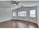 Bright bedroom with hardwood floors and ceiling fan at 3514 Old Course St, Las Vegas, NV 89122