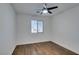 Bright bedroom with wood-look floors and ceiling fan at 3514 Old Course St, Las Vegas, NV 89122