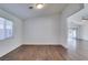 Simple dining area with hardwood floors and adjacent living room at 3514 Old Course St, Las Vegas, NV 89122