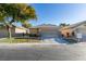 Single-story home with attached garage and landscaped yard at 3514 Old Course St, Las Vegas, NV 89122