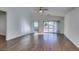 Living room with hardwood floors and sliding glass doors to patio at 3514 Old Course St, Las Vegas, NV 89122