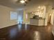 Spacious living room with hardwood floors and kitchen view at 3514 Old Course St, Las Vegas, NV 89122