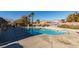 Community pool with surrounding landscaping at 3514 Old Course St, Las Vegas, NV 89122