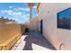 Small backyard with a block wall and a storage area at 3802 Terrazzo Ave, Las Vegas, NV 89115