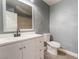 This bathroom includes a vanity with storage, a toilet, and a well-lit mirror, offering style and function at 3802 Terrazzo Ave, Las Vegas, NV 89115