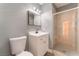 This bathroom offers a vanity, toilet, and a modern shower with glass doors, combining style and convenience at 3802 Terrazzo Ave, Las Vegas, NV 89115