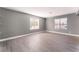 Bedroom featuring wood-look floors, neutral walls, and windows at 3802 Terrazzo Ave, Las Vegas, NV 89115