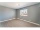 This cozy bedroom offers a bright window, gray walls, and modern flooring for a relaxing and inviting atmosphere at 3802 Terrazzo Ave, Las Vegas, NV 89115