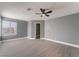 Bedroom featuring a ceiling fan, windows, and an open walk-in closet with built-in shelving at 3802 Terrazzo Ave, Las Vegas, NV 89115