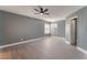 Bedroom with a ceiling fan, a double window, light gray walls, and wood-look flooring at 3802 Terrazzo Ave, Las Vegas, NV 89115