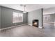 Dining area with fireplace, gray walls, and wood-look flooring at 3802 Terrazzo Ave, Las Vegas, NV 89115