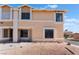 Front view of a two-story tan house at 3802 Terrazzo Ave, Las Vegas, NV 89115