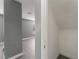 View of hall closet and light gray room with wood-look flooring and natural light from a window at 3802 Terrazzo Ave, Las Vegas, NV 89115